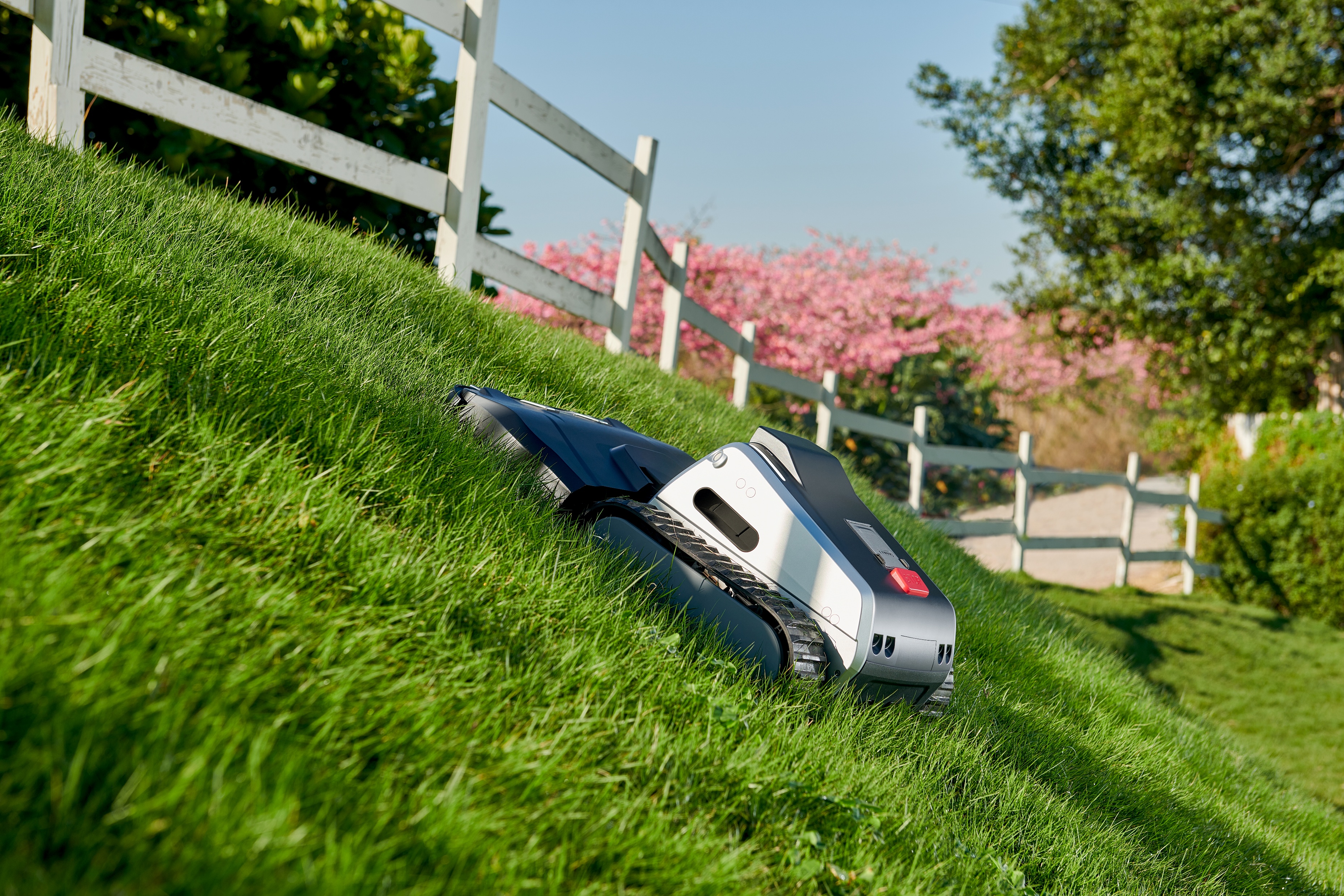 Lymow One Plus operating on a steep lawn